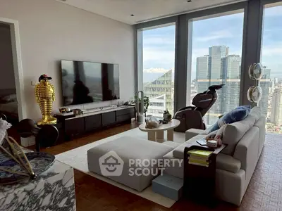 Luxurious high-rise living room with stunning city views and modern decor.