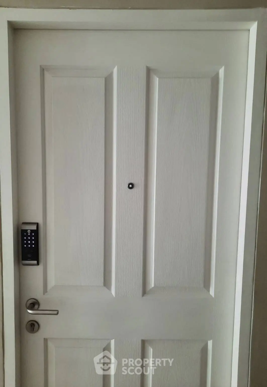 Modern white door with digital lock in stylish apartment entrance