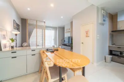 Modern open-plan living and dining area with stylish decor and natural light.