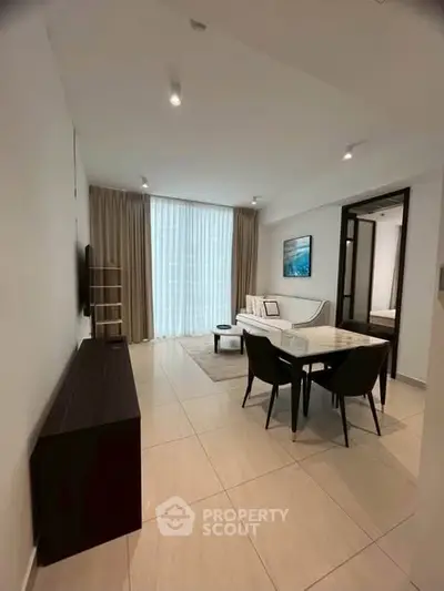 Modern living room with elegant dining area and natural light