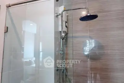 Modern bathroom with sleek shower design and glass partition