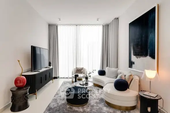 Elegant modern living room with stylish furniture and large artwork, featuring a cozy seating area and natural light.