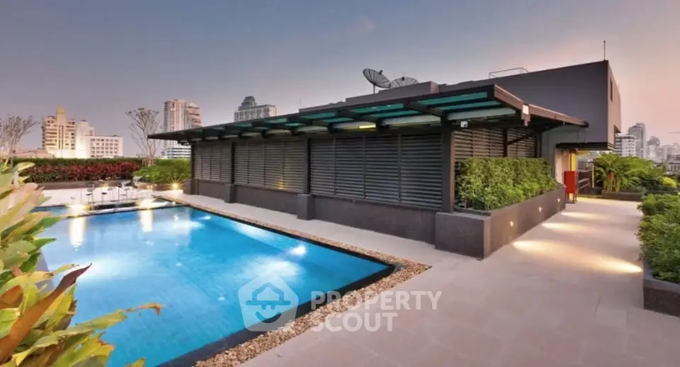 Luxurious rooftop pool with city skyline views, perfect for relaxation and entertainment.