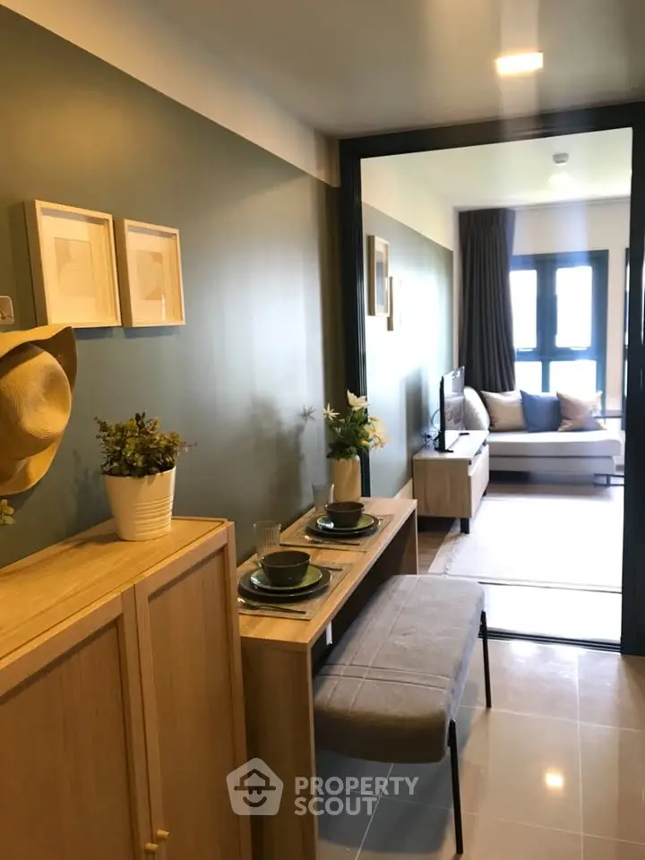 Modern open-plan living room with stylish decor and natural light