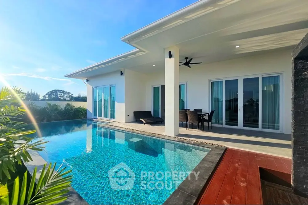 Luxurious modern villa with private pool and spacious patio, perfect for relaxation and entertainment.