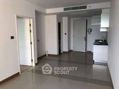 Modern apartment interior with sleek kitchen and open layout, perfect for urban living.