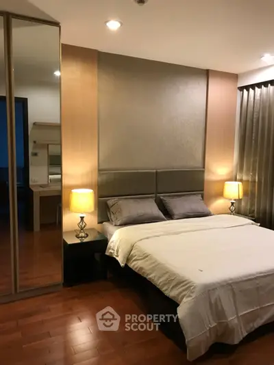 Elegant bedroom with modern decor and warm lighting