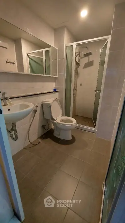 Modern bathroom with shower and toilet in a compact layout