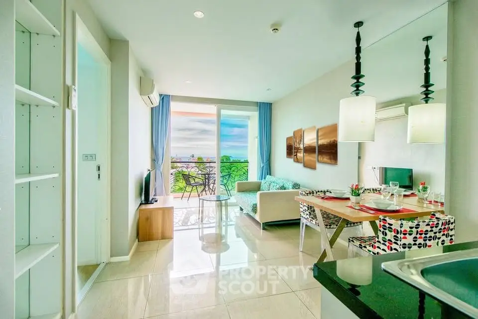 Bright and modern living room with ocean view, stylish decor, and open layout.