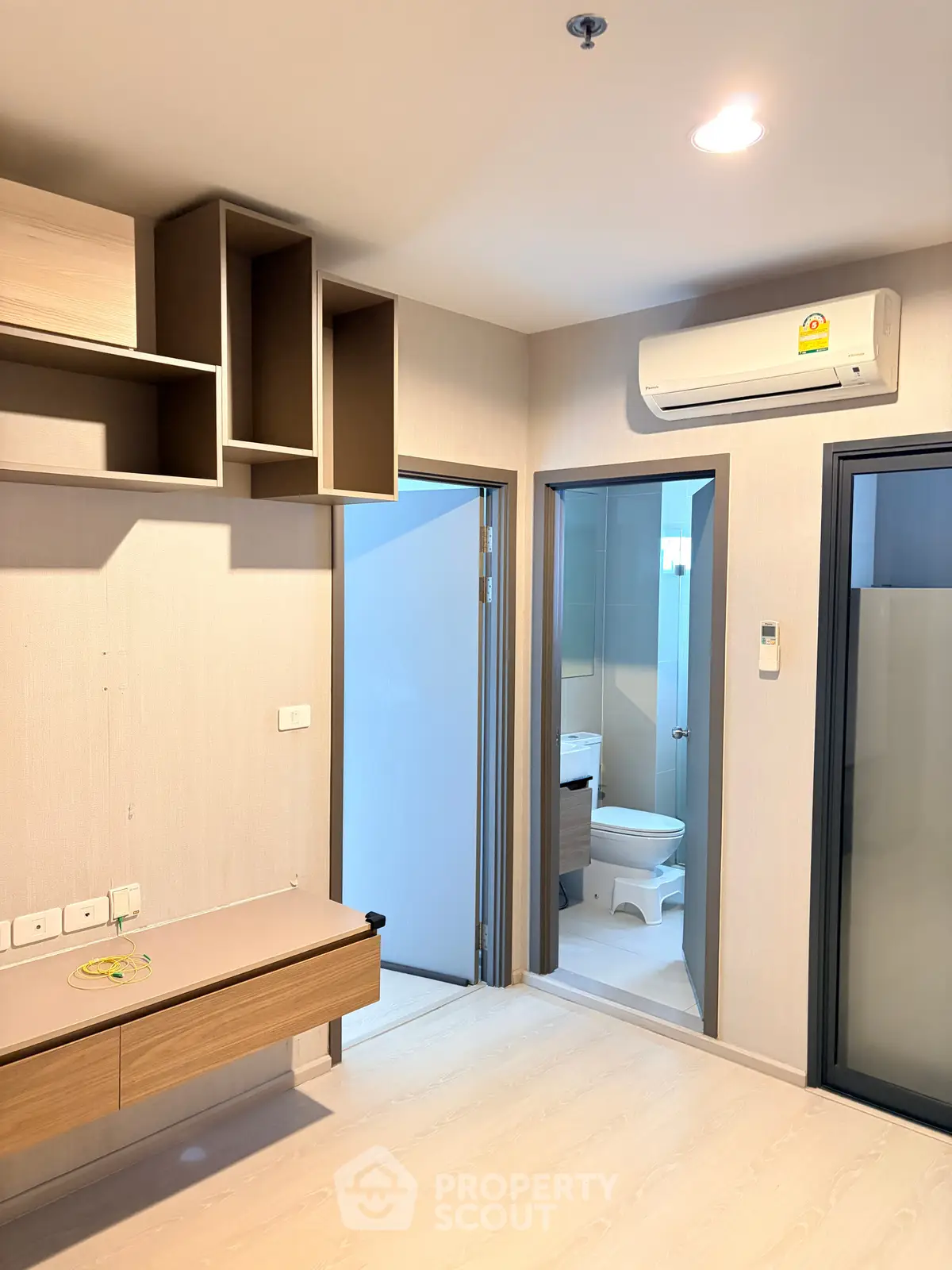 Modern apartment interior with air conditioning and bathroom view