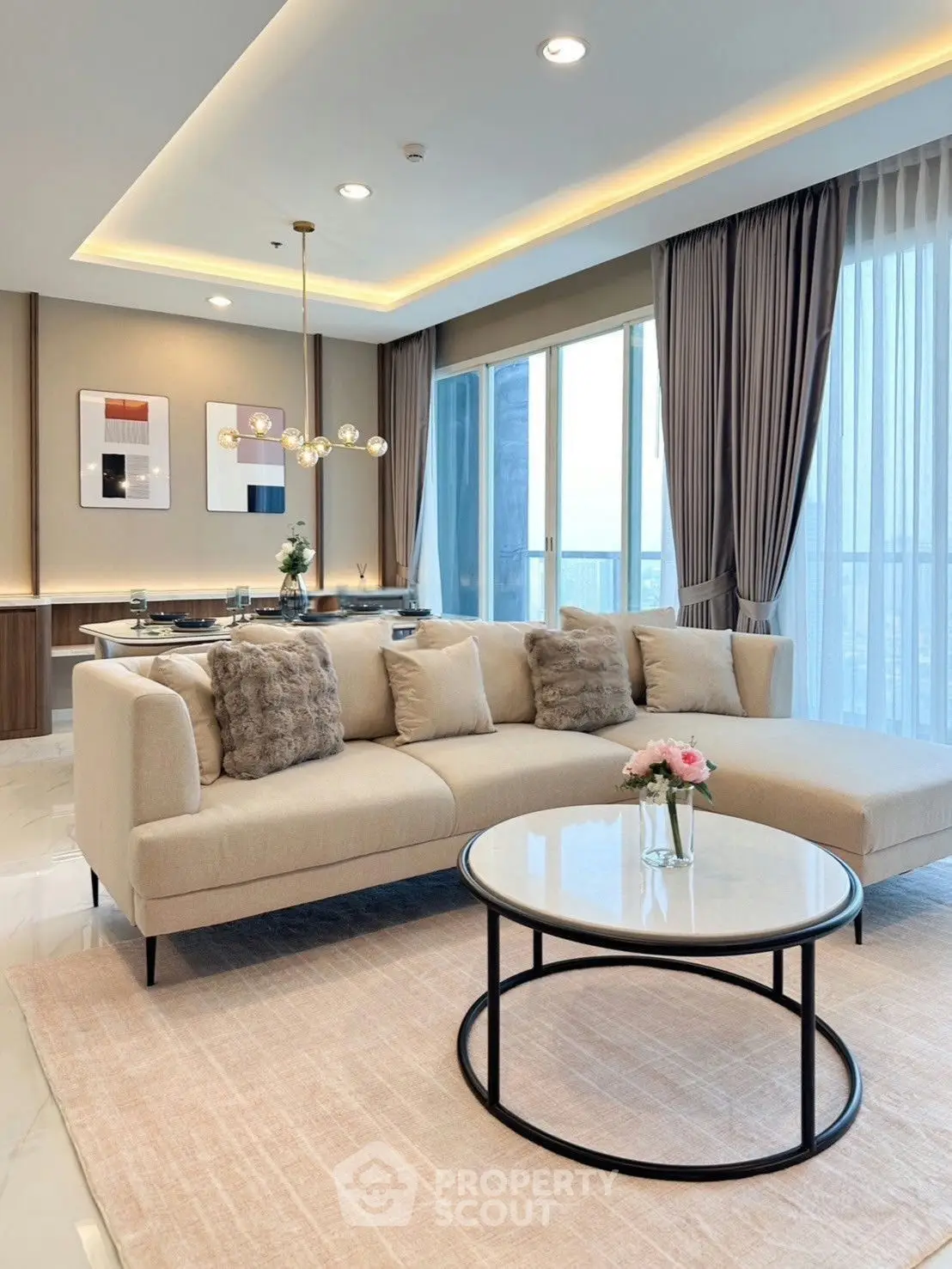 Luxurious modern living room with elegant decor and panoramic city view.