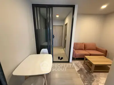 Modern living room with cozy sofa and dining area in open layout apartment