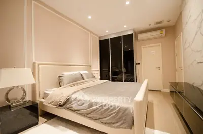 Luxurious modern bedroom with elegant decor and ambient lighting