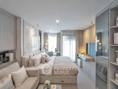 Luxurious modern bedroom with elegant decor and ample natural light