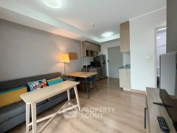 Modern living room with stylish furniture and open kitchen layout