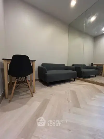 Modern minimalist study room with sleek furniture and large mirror