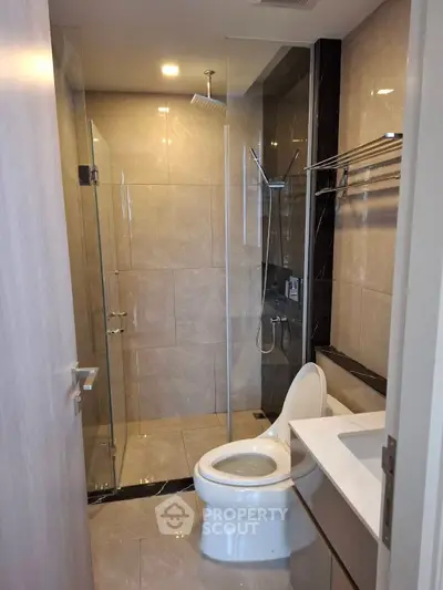 Modern bathroom with glass shower and sleek fixtures