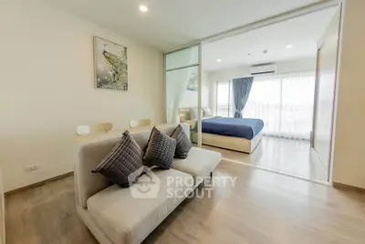 Modern open-plan living room with stylish decor and natural light