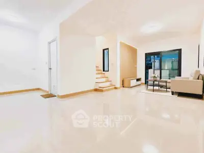 Spacious modern living room with sleek design and natural light
