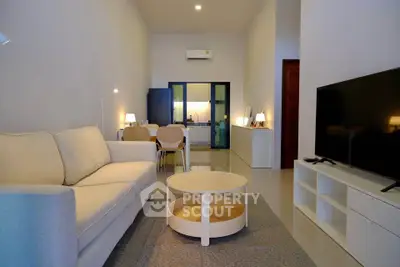 Modern living room with sleek furniture and open layout, perfect for contemporary living.