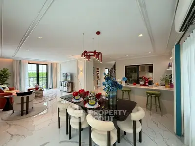 Luxurious open-plan living and dining area with modern decor and elegant furnishings.