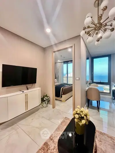Luxurious modern apartment with ocean view, elegant decor, and spacious layout, perfect for sophisticated living.
