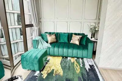 Luxurious modern living room with green velvet sofa and stylish decor