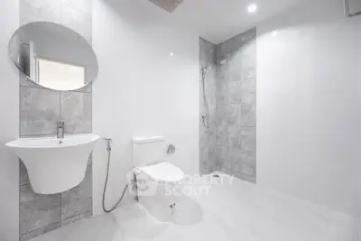 Modern minimalist bathroom with sleek fixtures and spacious design