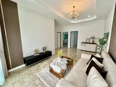 Elegant living room with modern decor and plush seating in a spacious layout.
