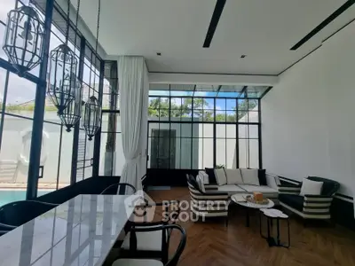 Luxurious modern living room with high ceilings and elegant decor