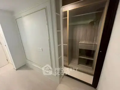 Spacious walk-in closet with elegant wood finish and ample storage space