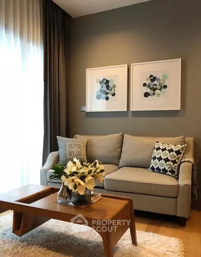 Stylish living room with modern decor, cozy sofa, and elegant wooden coffee table.