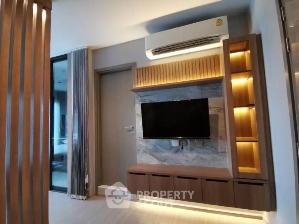 Modern living room with sleek TV unit and ambient lighting