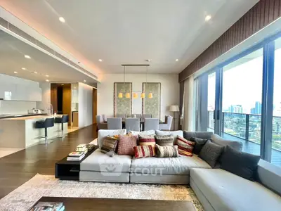 Luxurious open-plan living room with stunning city views and modern decor