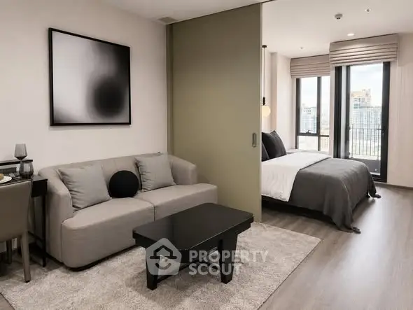 Modern studio apartment with stylish decor and city view, featuring a cozy living area and elegant bedroom.
