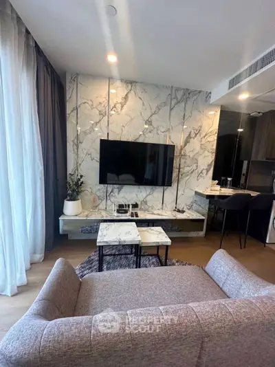 Modern living room with marble accent wall and sleek furniture