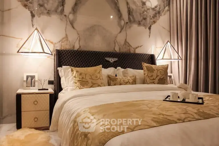 Luxurious bedroom with elegant decor and plush bedding in a sophisticated setting.
