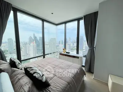 Luxurious bedroom with panoramic city view in modern high-rise apartment
