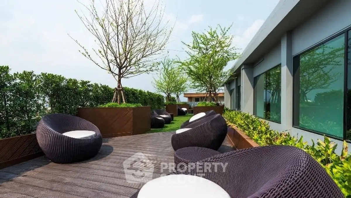 Luxurious rooftop terrace with modern seating and lush greenery