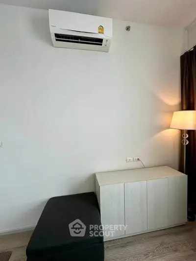 Modern living room with air conditioning and stylish furniture