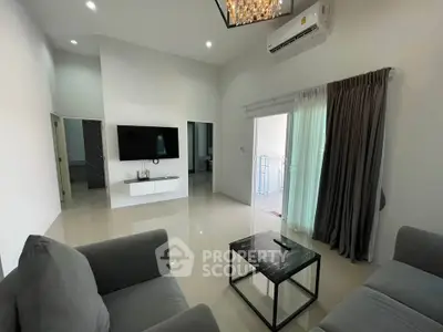 Spacious modern living room with sleek furniture and natural light