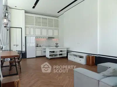 Spacious modern living room with open kitchen and stylish decor