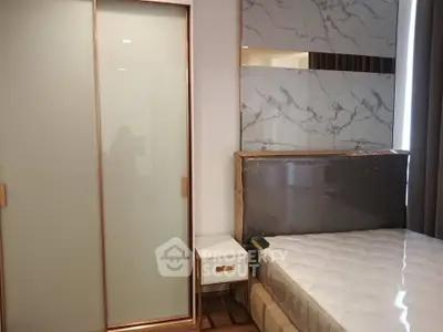 Modern bedroom with stylish wardrobe and elegant marble accent wall