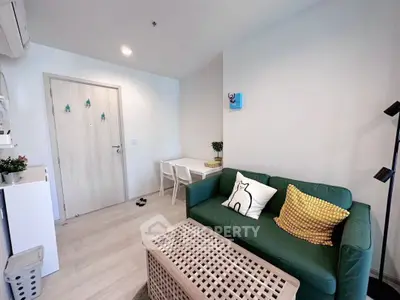 Charming living room with green sofa and modern decor in cozy apartment