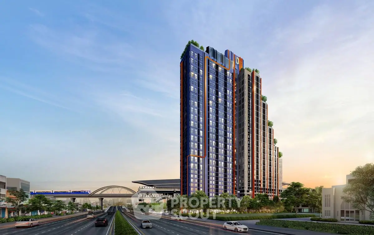 Modern high-rise building with lush greenery and city view