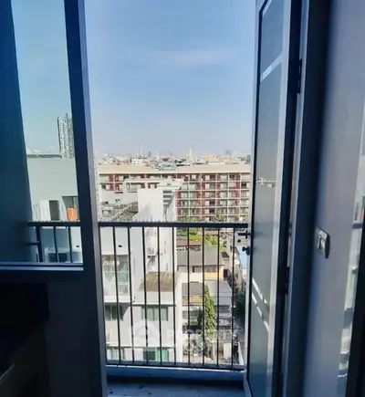 Stunning cityscape view from a modern apartment balcony, perfect for urban living.