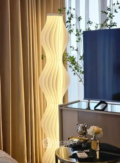 Stylish modern living room with unique floor lamp and elegant decor
