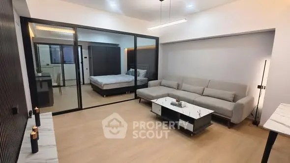 Modern open-plan living room with sleek design and cozy ambiance