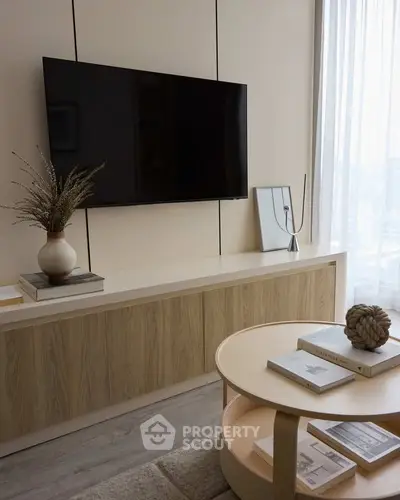 Modern living room with wall-mounted TV and stylish decor