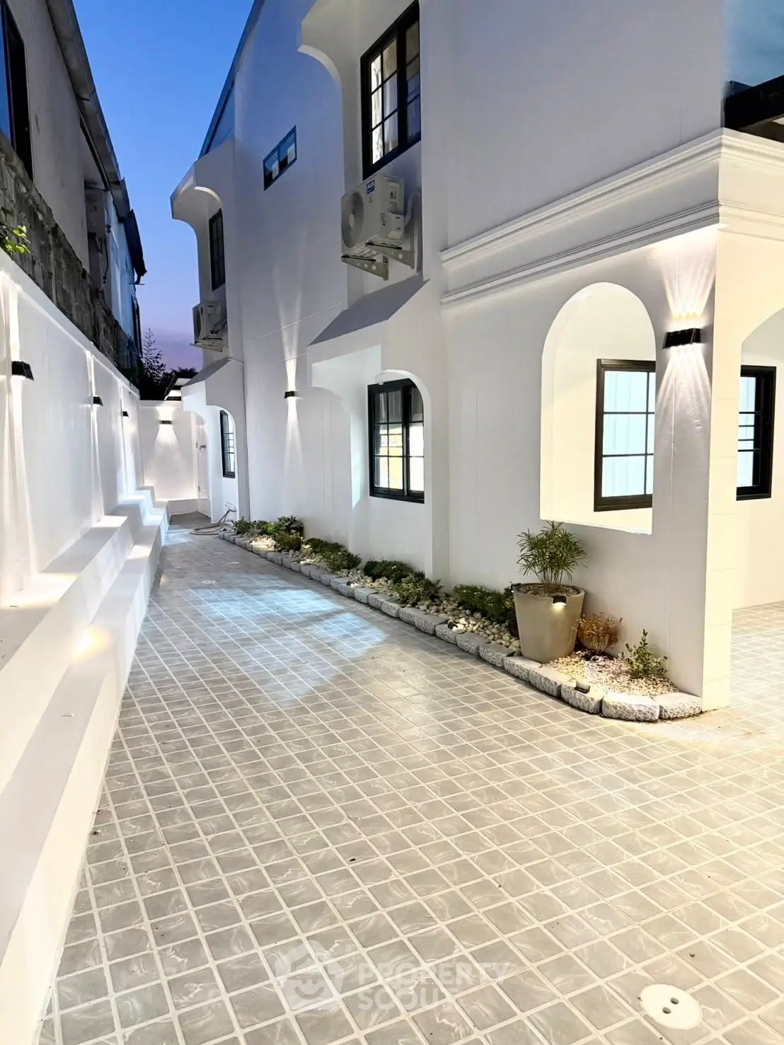 Stunning modern exterior with elegant lighting and sleek architectural design.